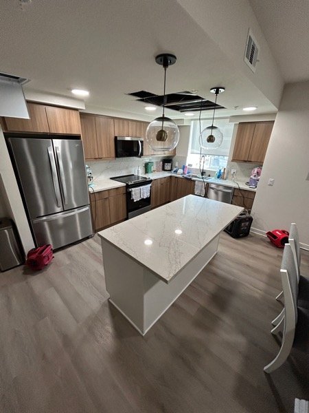 Kitchen ceiling cut open for access above the island