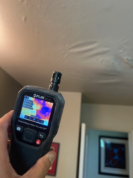Close-up thermal camera reading of ceiling moisture
