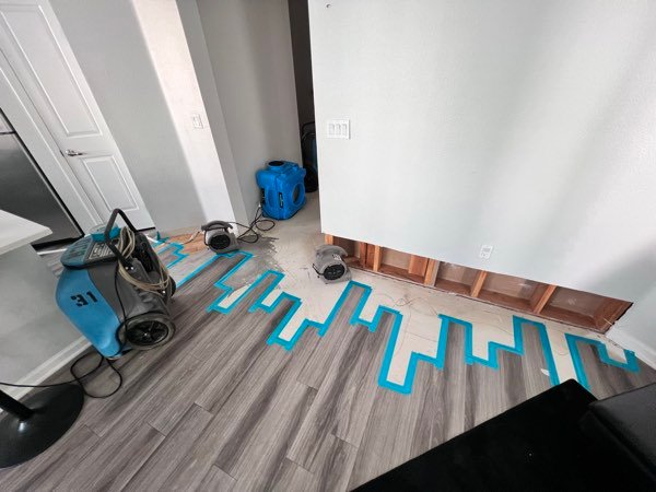 Floor drying mat system with air movers extracting moisture from flooring